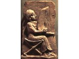Musician, playing a harp, on clay plaque from Khafajah, Mesopotamia. c.2000 BC. (Louvre, Paris).